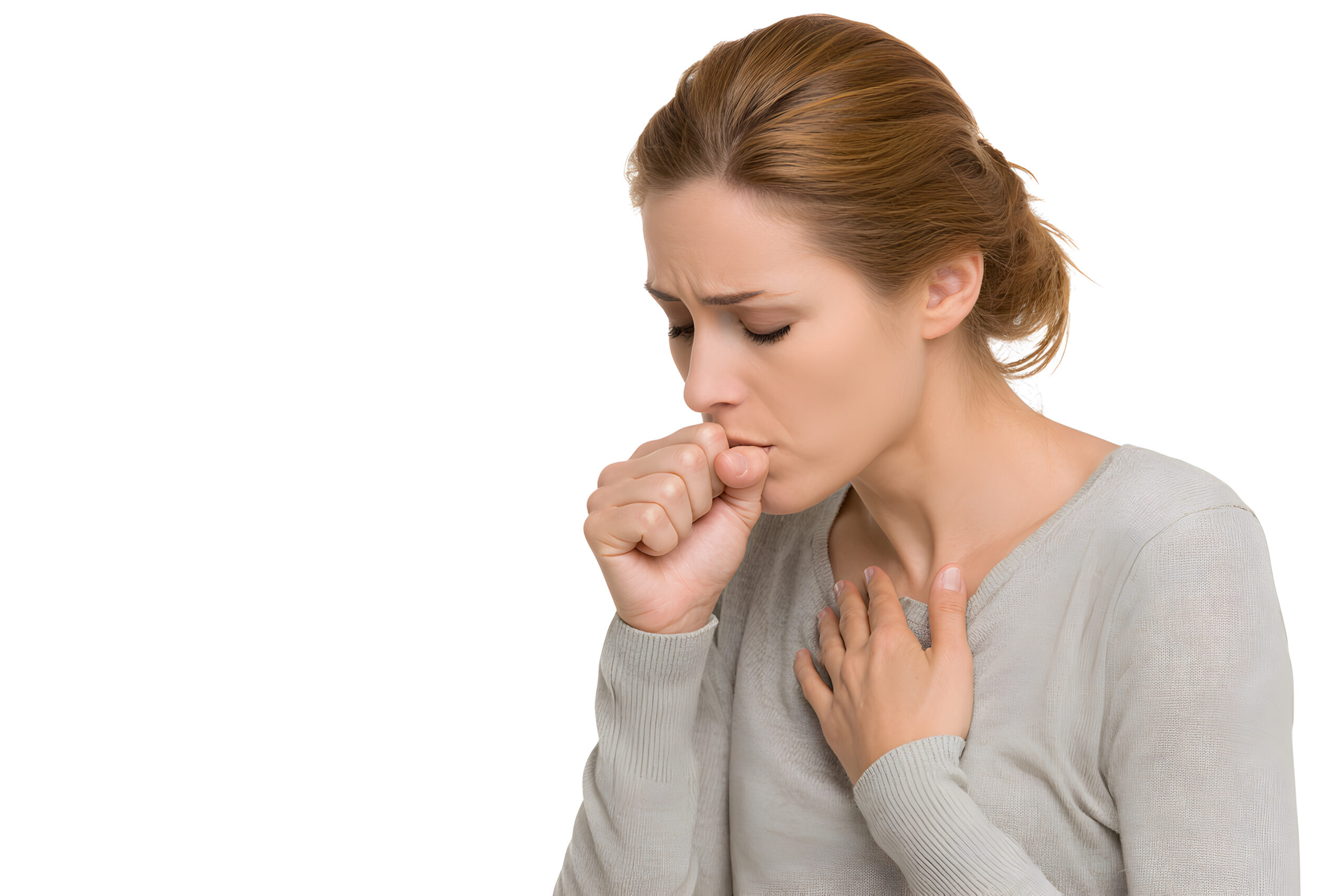 A woman coughing, with her hand covering her mouth and a pained expression on her face